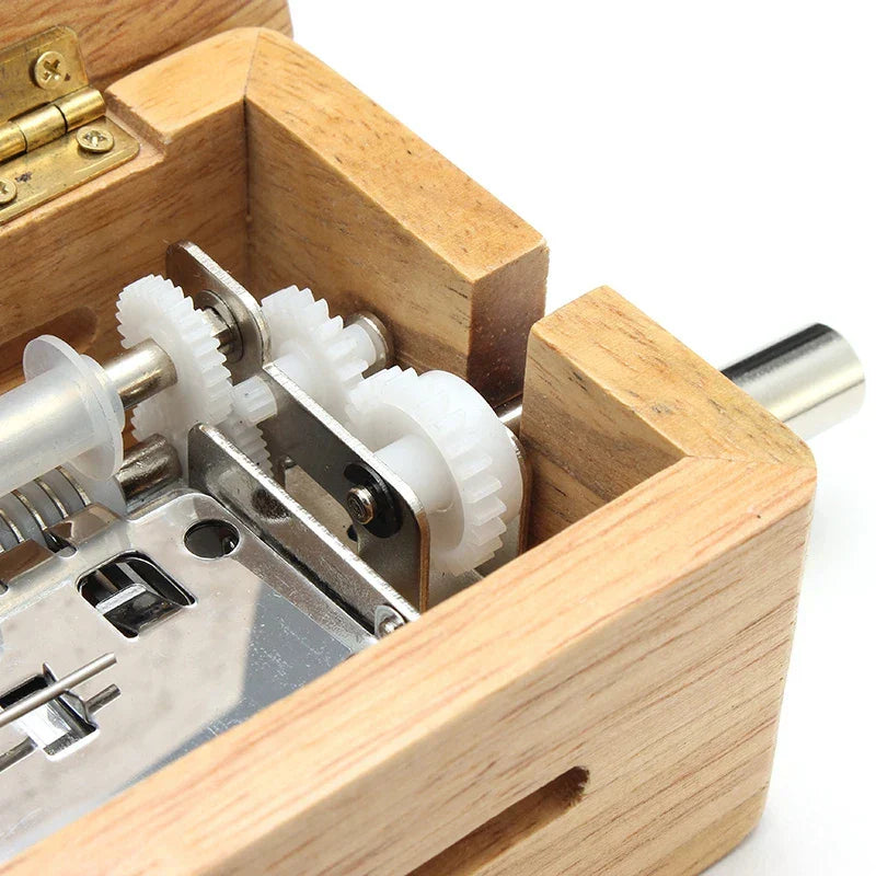 A wooden 15 30 tone hand-cranked music box with white plastic gears paper tape puncher for music paper composing creative diy movement
