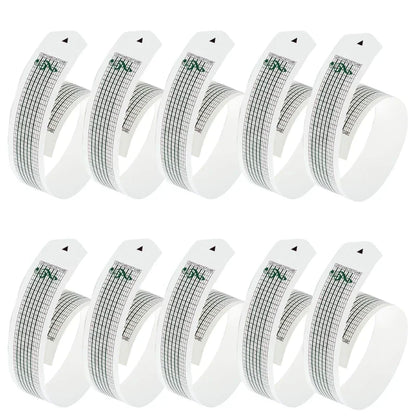 Ten white curved paper tape sheets with black grid lines for 15note diy hand crank music box movement