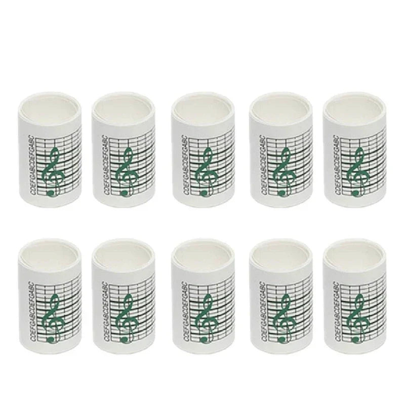 White cylindrical paper tape rolls with green treble clef for 15note diy hand crank music box movement