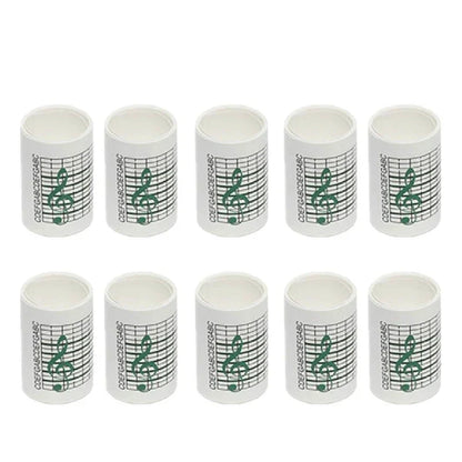 White cylindrical paper tape rolls with green treble clef for 15note diy hand crank music box movement