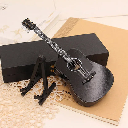 Black 18cm wooden mini electric guitar with glossy finish and white binding on support miniature model stand