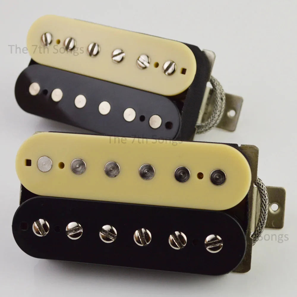 Two cream and black 1959 paf g alnico humbucker guitar pickups with silver screws and braided leadd for vintage tone