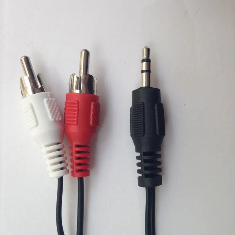Set of stereo audio car cable splitter with white and red rca plugs and black 3.5mm aux stereo jack connectors
