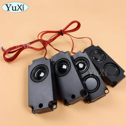 Four black rectangular yuxi audio portable speakers with circular drivers and red wiring for computer pc and lcd tv use