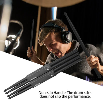 Black nylon drumsticks with non slip handles branded damnation shown in dynamic performance pose for professional use