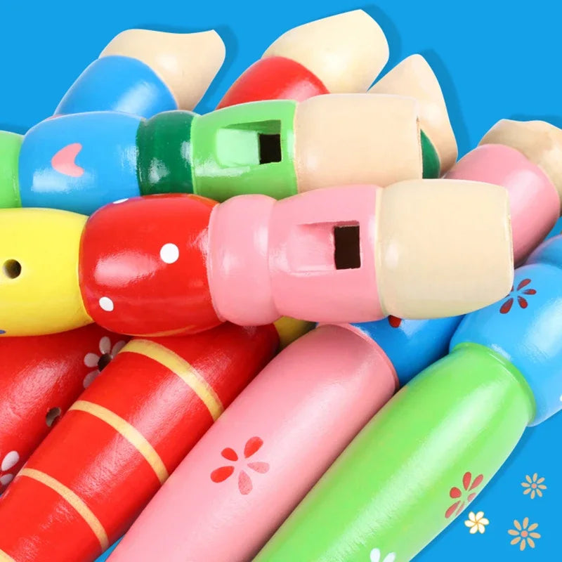 A collection of colorful wooden flute trumpet buglet hooters decorated with floral patterns for kids educational learning