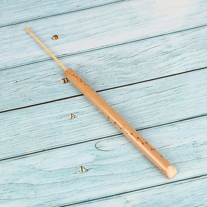 Light brown bamboo musical instrument bird whistle with smooth polished finish and natural grain patterns for mini music rhythm