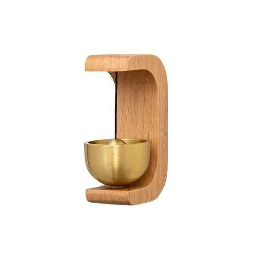 A polished 1pc brass doorbell reminder wind chime in a light wooden holder for housewarming home decoration