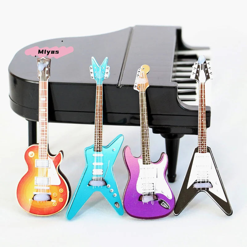 1pc classic guitar miniature simulation musical instrument model decorative accessory in orange turquoise purple and black displayed with a piano