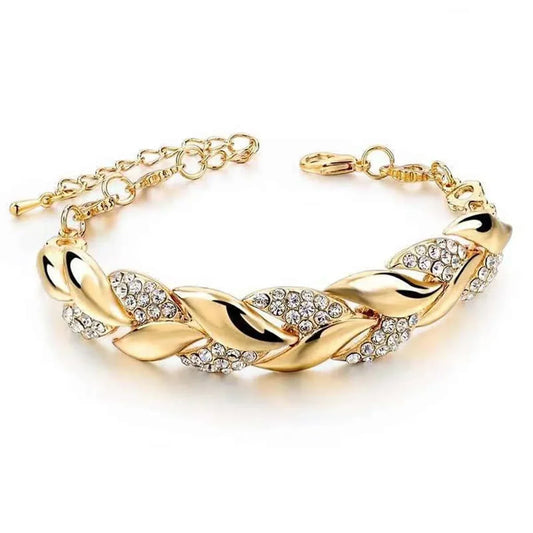 Gold-toned hip hop leaf pendant bracelet elegant with twisted shining crystal stones and adjustable braided chain clasp