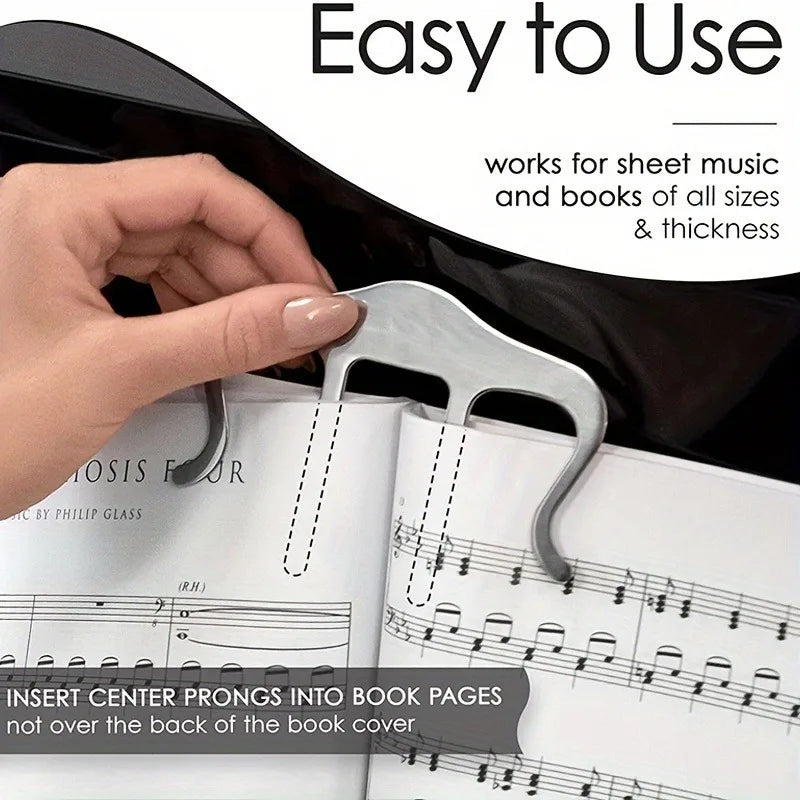 Silver metal music book clip with sleek curved design effortlessly displays sheet music for easy reading perfect use