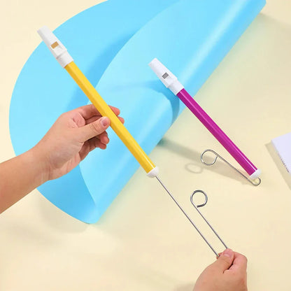 Yellow and white plastic sliding whistle toy with metal hook attachment toy blowing flute for children classic use