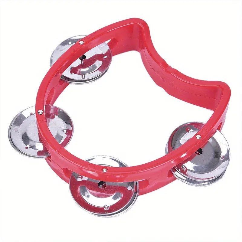 Red plastic percussion tambourine with four chrome jingles designed as an adults hand tambourine musical rhythm instrument