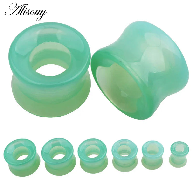 A set of translucent green stone glass ear gauges in mixed style hollow single flared design by alisouy