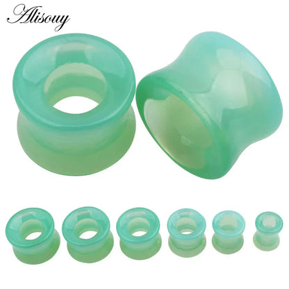 A set of translucent green stone glass ear gauges in mixed style hollow single flared design by alisouy