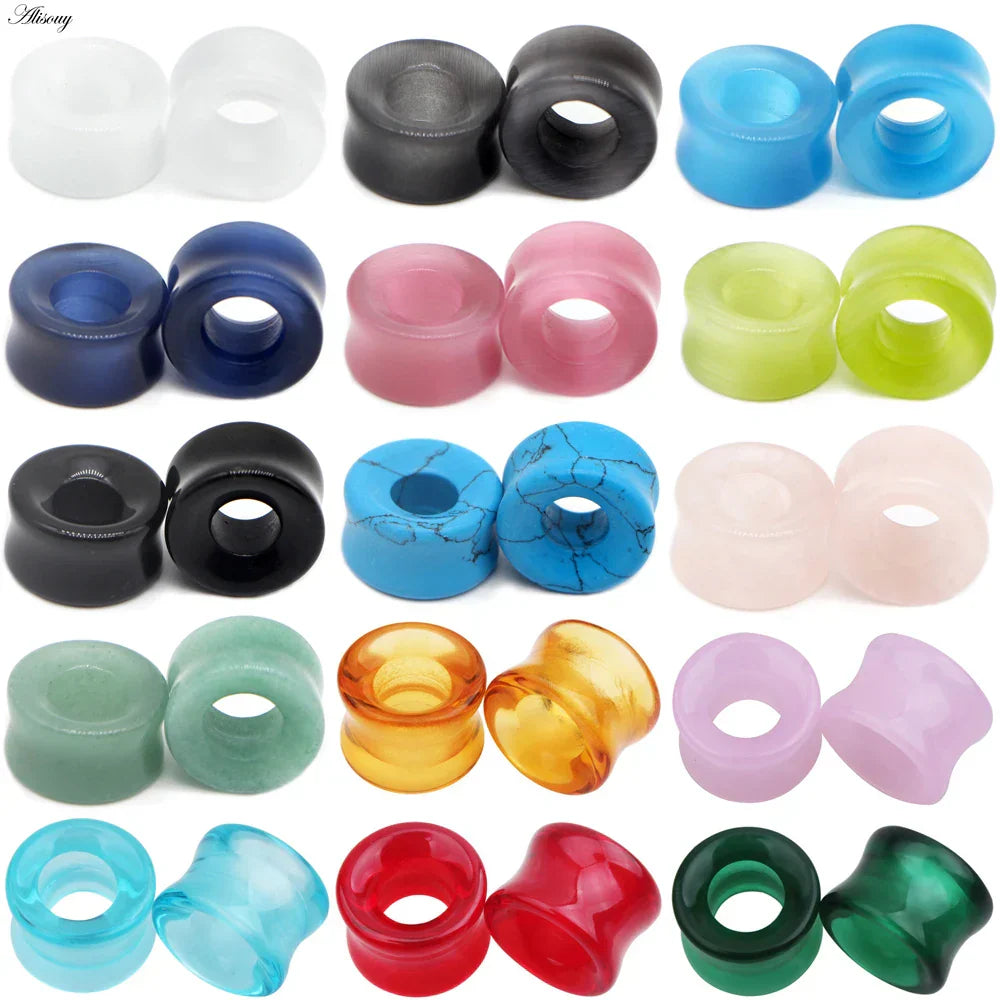 A collection of colorful translucent silicone stone glass ear plugs in mixed style hollow single flared design