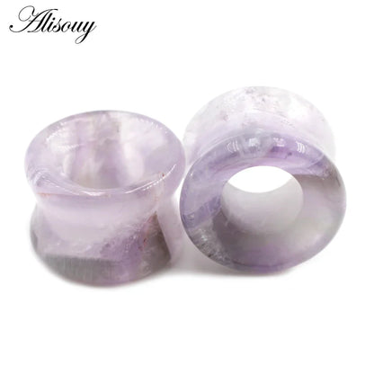 A pair of translucent purple amethyst stone glass ear plugs with mixed style hollow single flared design for ear stretching