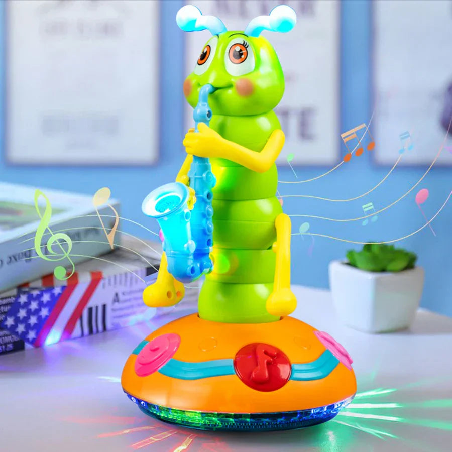 A bright green children’s electric caterpillar saxophone toy with yellow limbs and blue antennae on an orange base