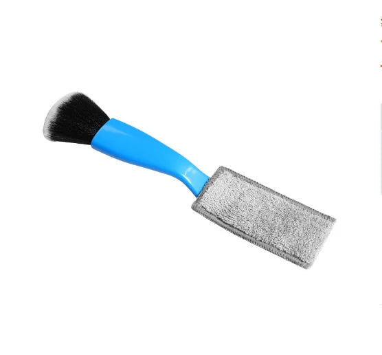 Blue-handled guitar care brush with black bristles and gray microfiber cloth for string fingerboard cleaning and dust removal