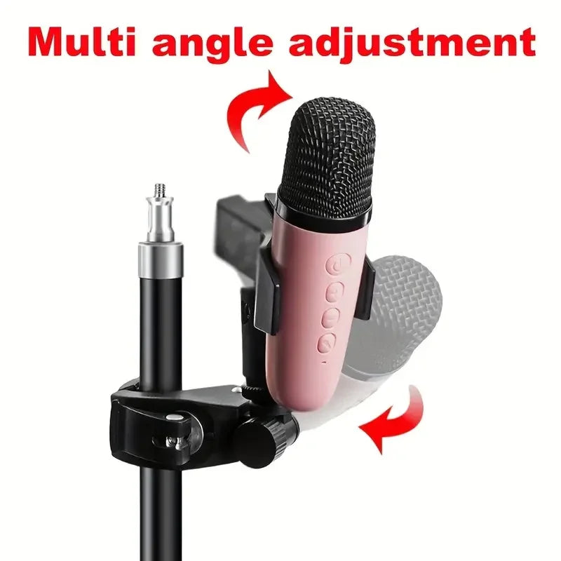 Pink condenser microphone with black mesh grille mounted on a black 4pcs adjustable microphone crab clamp for drum rim use