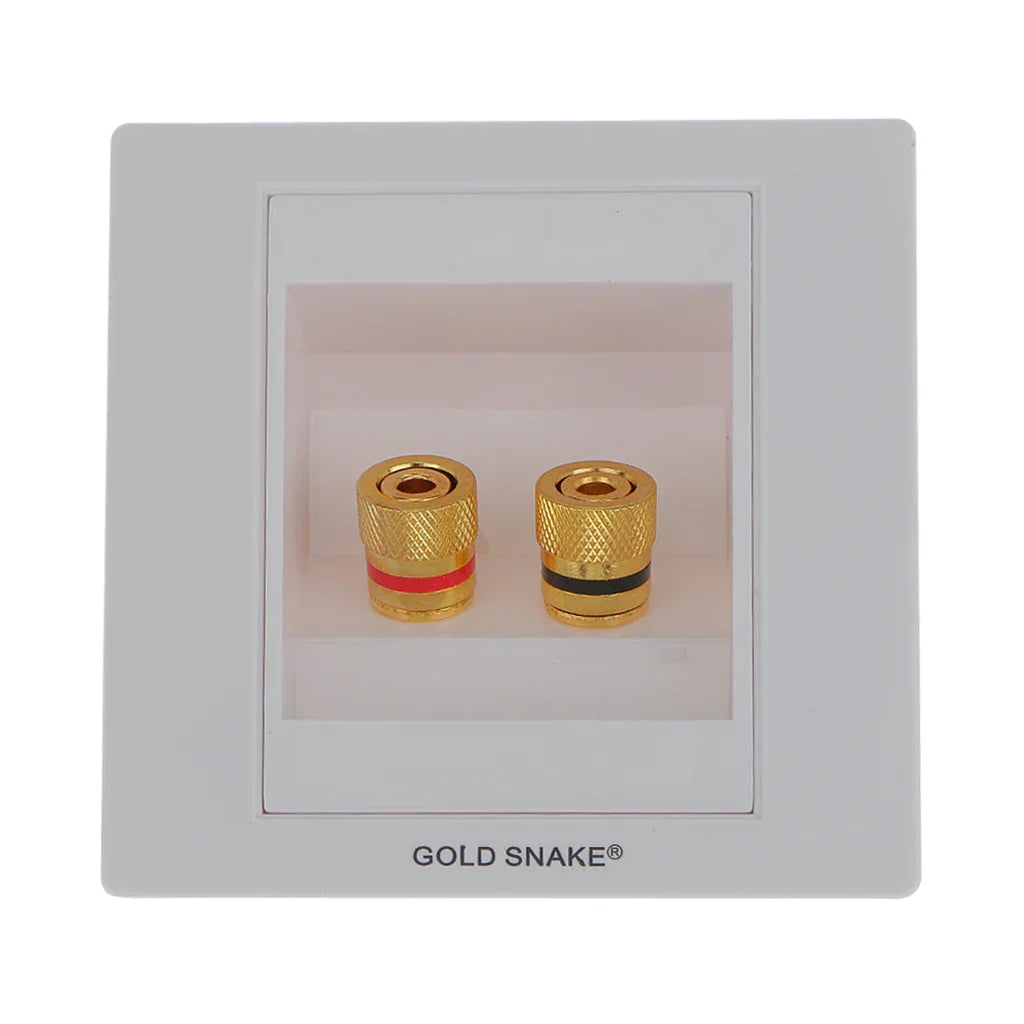 Gold-plated binding post banana plugs with textured knurled surfaces and colored bands in white plastic audio surround wall face plate