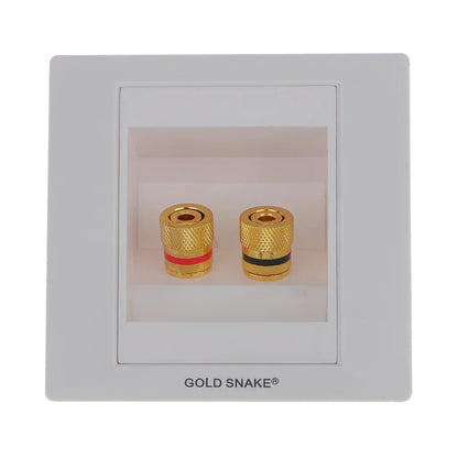 Gold-plated binding post banana plugs with textured knurled surfaces and colored bands in white plastic audio surround wall face plate