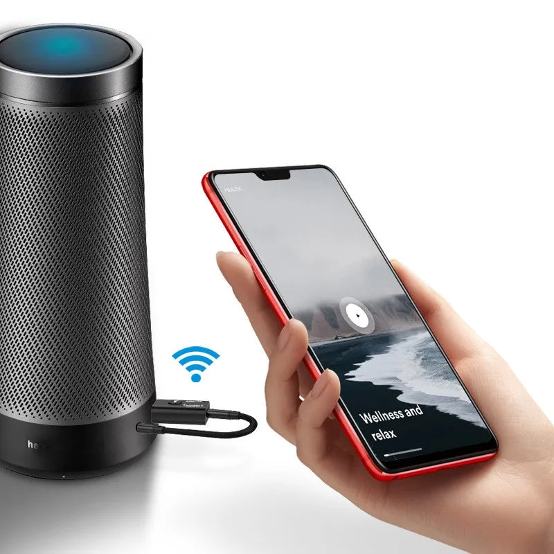 Black cylindrical smart speaker with perforated grille and blue illuminated top 2 in 1 music wireless adapter with 3.5mm aux for car kit speaker