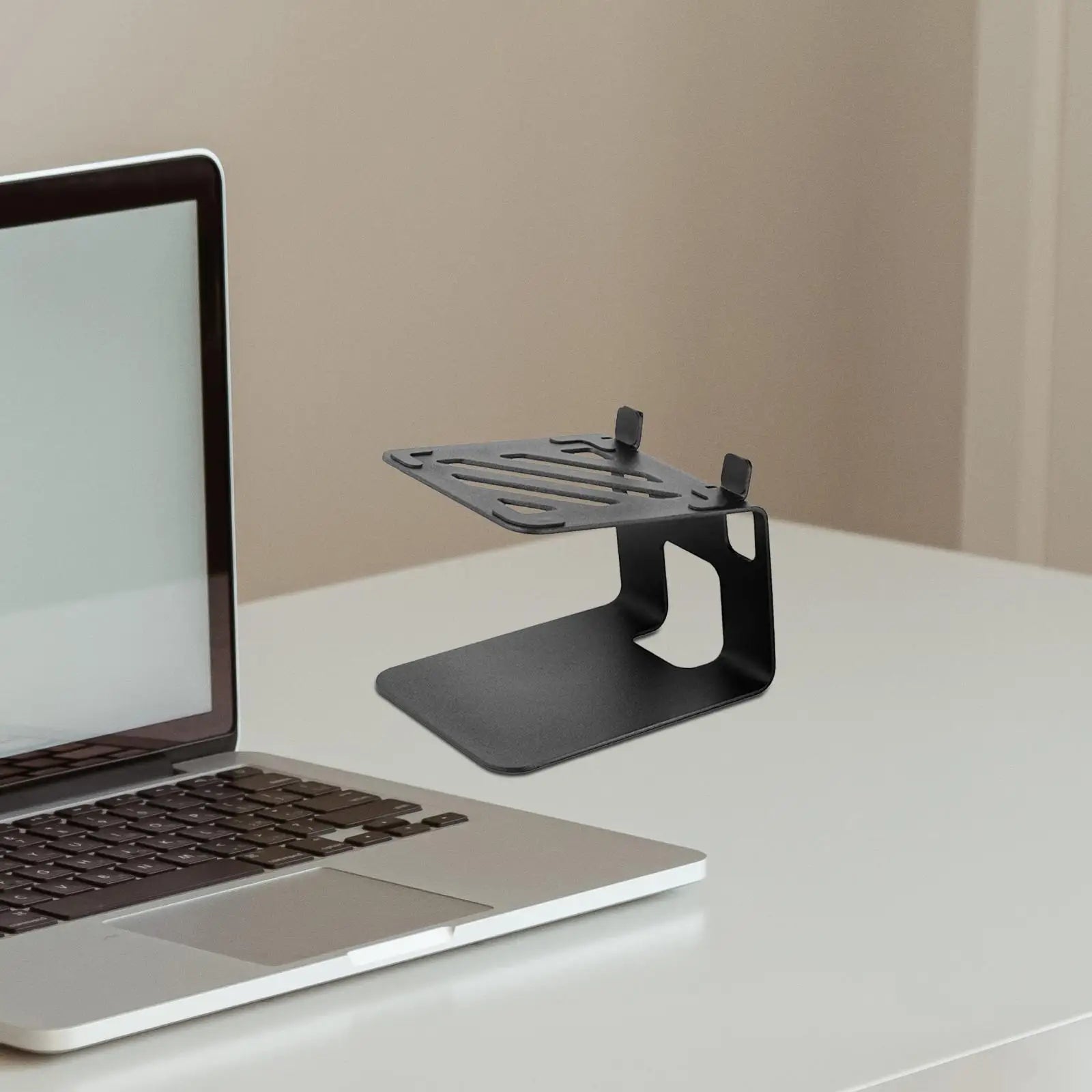 Black metal speaker desktop stand with adjustable height ventilation slots steel accessory for home office use