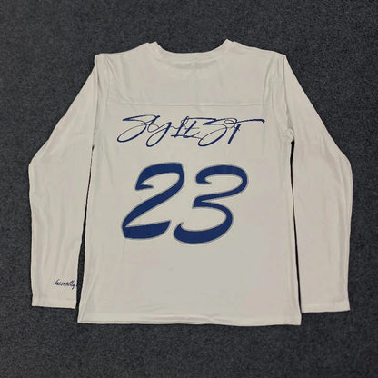 Back of a white long-sleeved shirt with navy cursive signature and bold outlined 23 in 2000s simple fashion harajuku streetwear hip letter printing round style