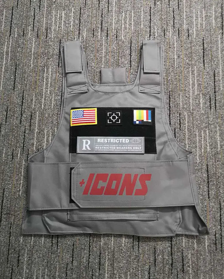 Gray tactical vest with red plus icon logo, american flag, camera, and rainbow patches for street fashion use