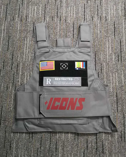 Gray tactical vest with red plus icon logo, american flag, camera, and rainbow patches for street fashion use