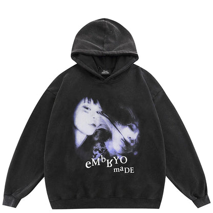 Black velvet oversized hoodie with distressed purple and white face graphic and embryo made text for streetwear style