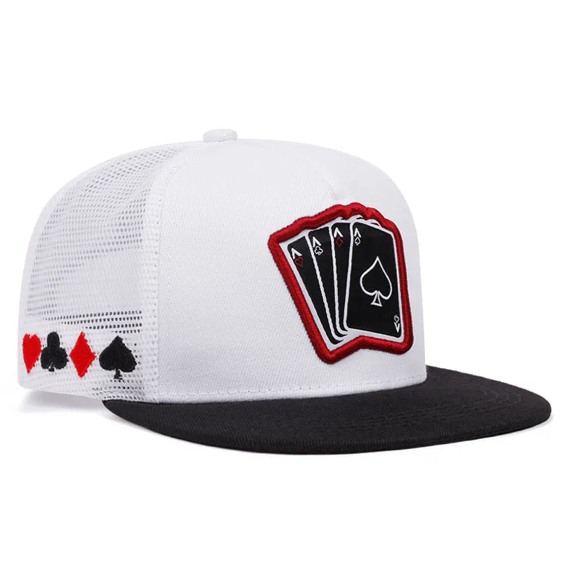 White and black unisex snapback trucker hat with red-trimmed playing card embroidered patch and suit symbols, fashion hip hop style