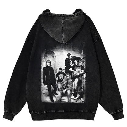 Black oversized washed cotton hoodie showing the back side with a faded black and white band photo print for winter streetwear