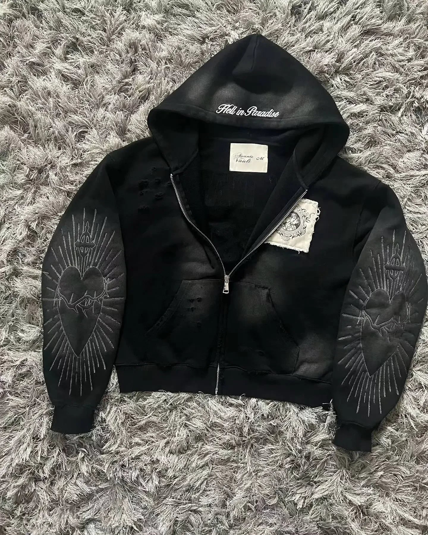 Black oversized zip-up hoodie with embroidered hearts on sleeves and fall in paradise on hood fashion oversized pattern y2k gothic harajuku