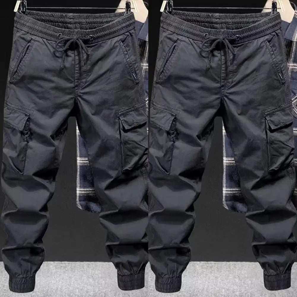 Black men cargo pants with drawstring waistband and elastic cuffs designed for streetwear hip hop style