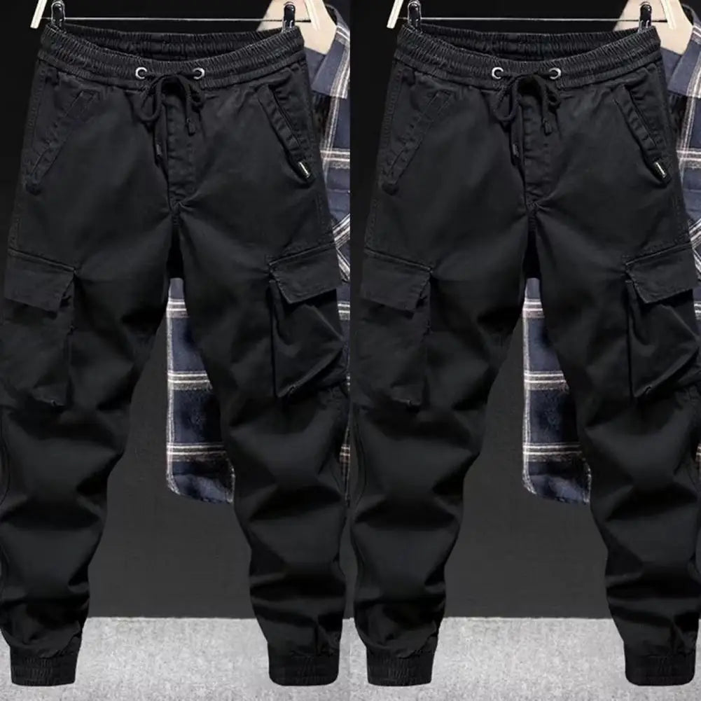 Black men cargo pants with elastic waistband drawstring multiple pockets tapered legs streetwear hip hop style