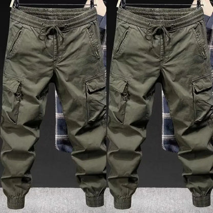 Olive green men cargo pants with drawstring waistband and multiple pockets designed for streetwear hip hop style