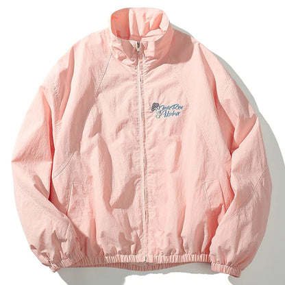 A soft pink lightweight windbreaker retro streetwear hip hop jacket with subtle embroidered logo for autumn harajuku style