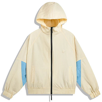 Cream-colored hip hop jacket windbreaker retro streetwear with light blue sleeve panels and embroidered chest logo