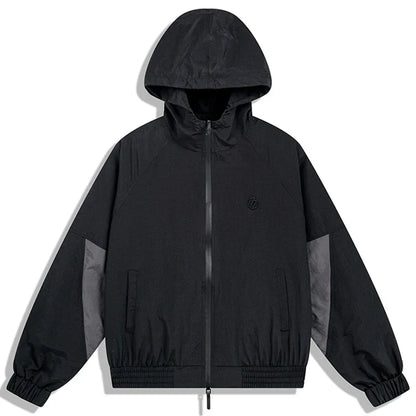 Black hooded hip hop jacket with gray panel accents and embroidered logo in windbreaker retro streetwear style for autumn harajuku