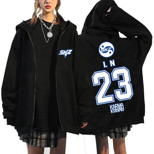 Back view of black fleece-lined zip-up hoodie fashion casual with blue skz kpop karma print logo and number 23