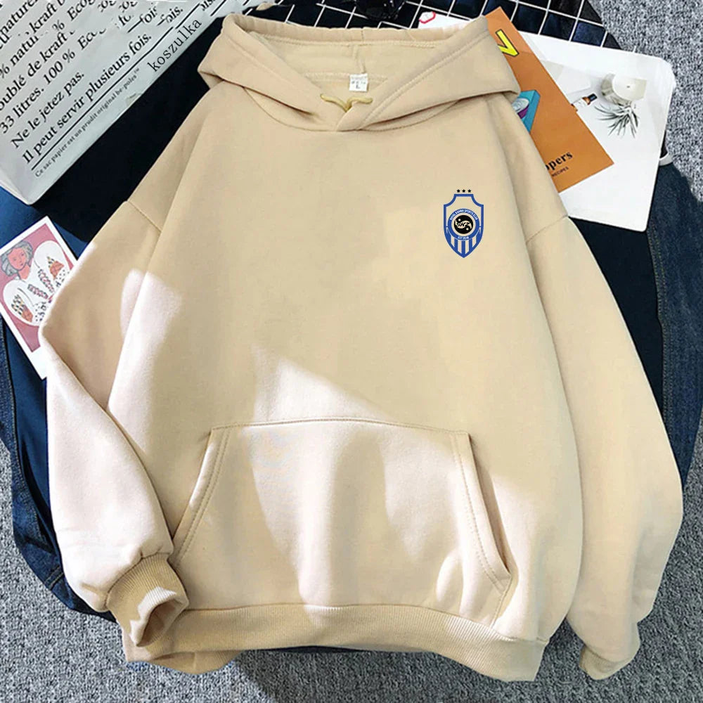 Beige hooded sweatshirt with blue and white shield emblem featuring the album karma hoodie design for autumn winter wear