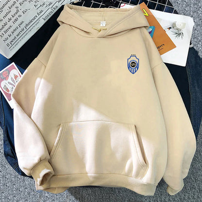 Beige hooded sweatshirt with blue and white shield emblem featuring the album karma hoodie design for autumn winter wear
