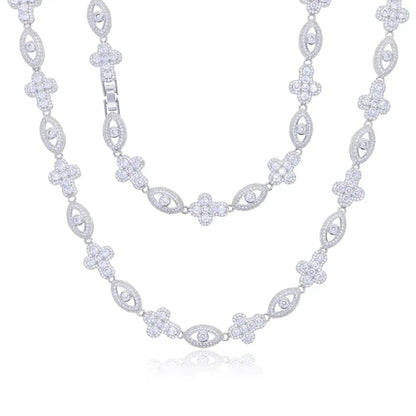 A sparkling silver eye cross necklace with charm tennis chain design featuring cubic zirconia for hip hop jewelry