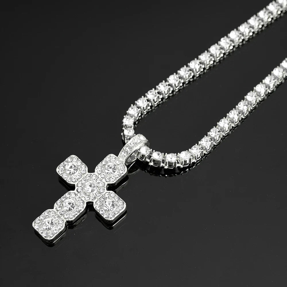 A sparkling silver hip hop cross pendant necklace men with clear crystals on a sleek tennis chain iced design