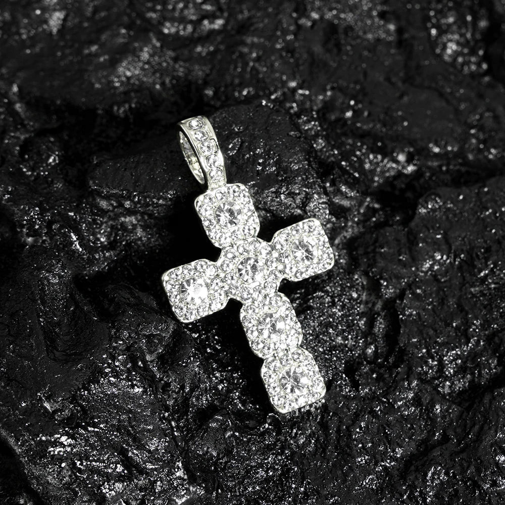 A sparkling silver hip hop cross pendant necklace men with clear crystals on a tennis chain iced design