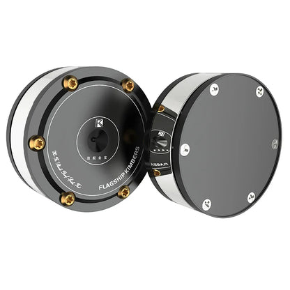 Black and silver flagship kimbers circular audio speakers with gold screws and audiophile shock damping amplifier spike stand