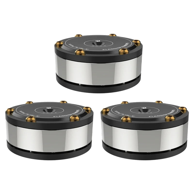 Three black and silver cylindrical speakers with gold-colored screws featuring audiophile shock damping amplifier spike stand and stand hifi isolation feet