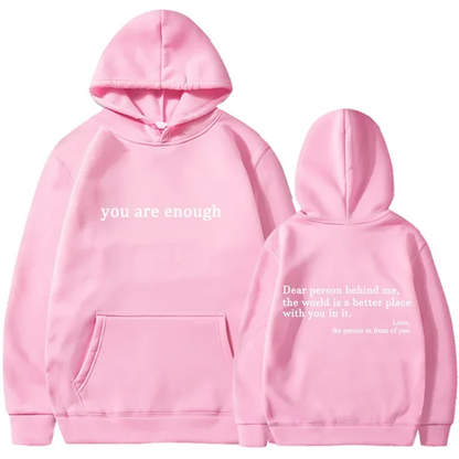 Pink pullover retro hoodie with white text front and back featuring a cozy hood for hip hop unisex street style